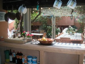 Shaded summer kitchen and barbecue area at Villa La Saudade